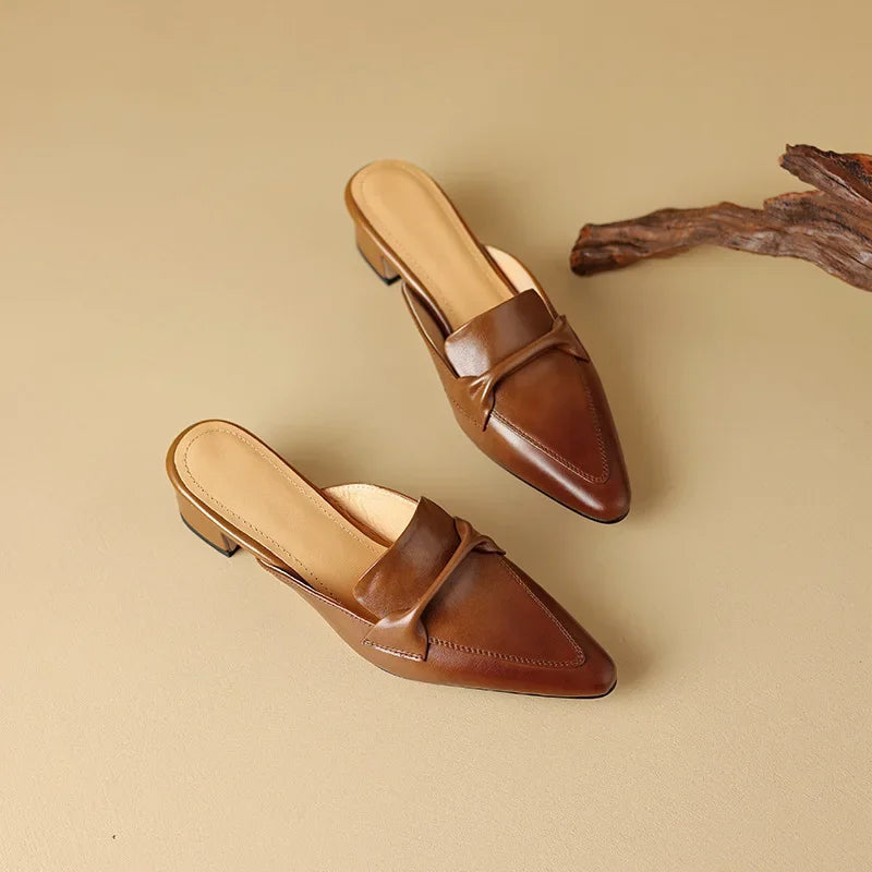 Pair of brown and beige genuine leather mules with low block heel and slip-on tops