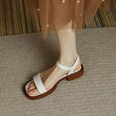 White leather platform sandals with open toe and ankle strap