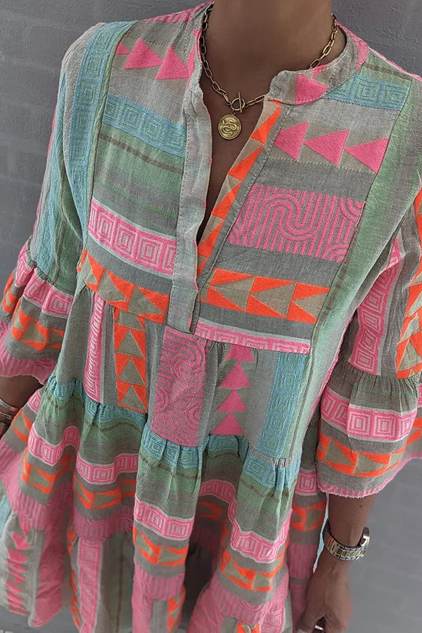 Boho spring dress close-up: geometric blocks, button-front bodice, tiered skirt
