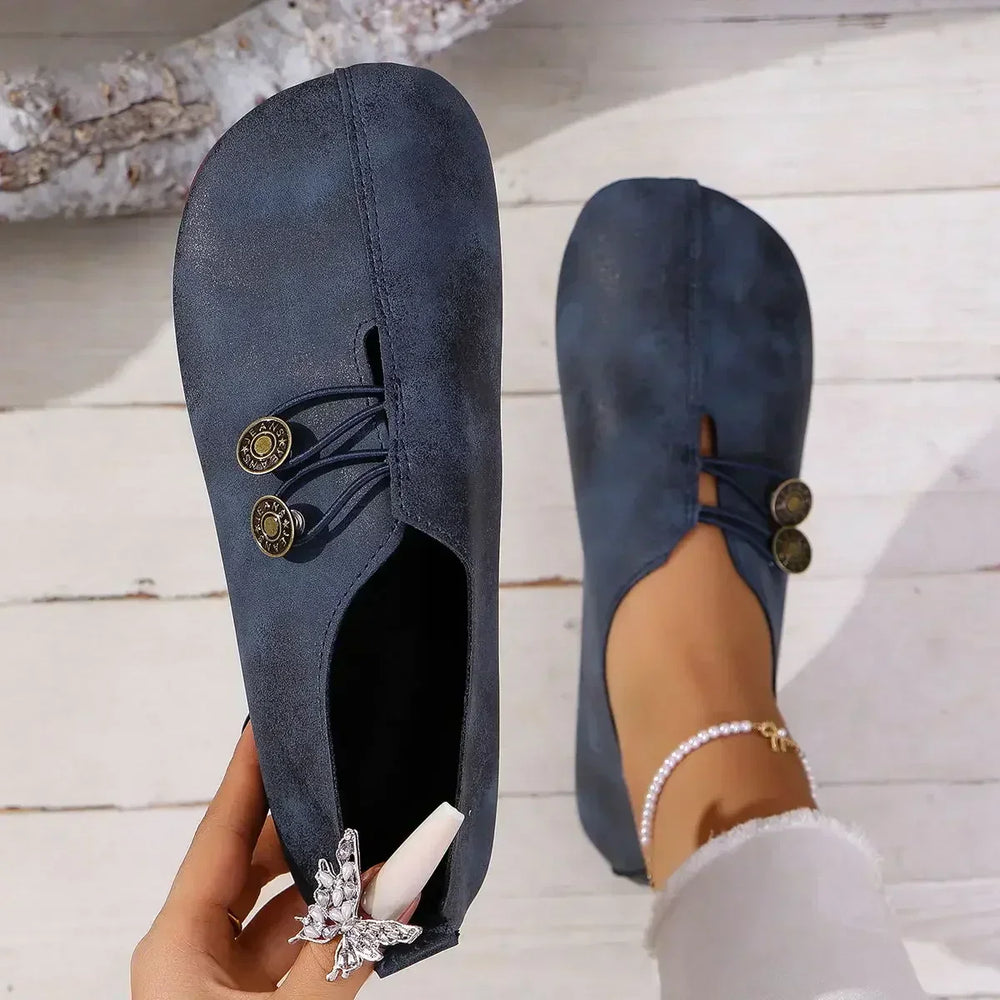 Women’s orthopedic suede loafers, dark navy lace-up with decorative medallion detail