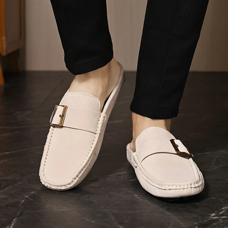 Cream suede slip-on mules with square buckle detail and side stitching