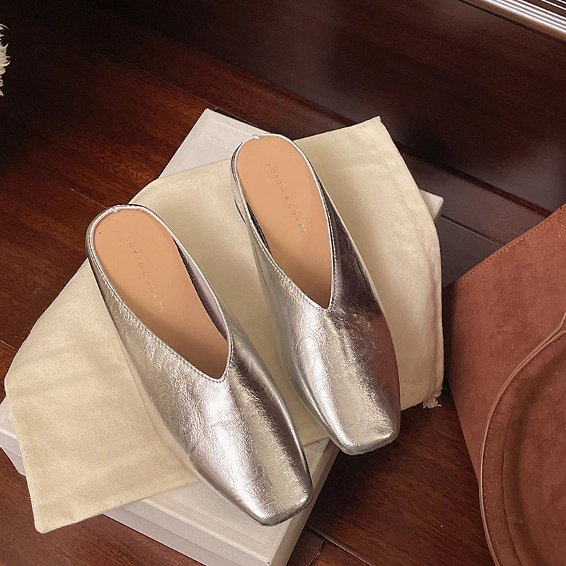 Pair of Lyra mules silver metallic slip-ons with square-toe and low block heels