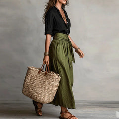 Two-tone maxi dress with black wrap-style bodice and olive green gathered skirt