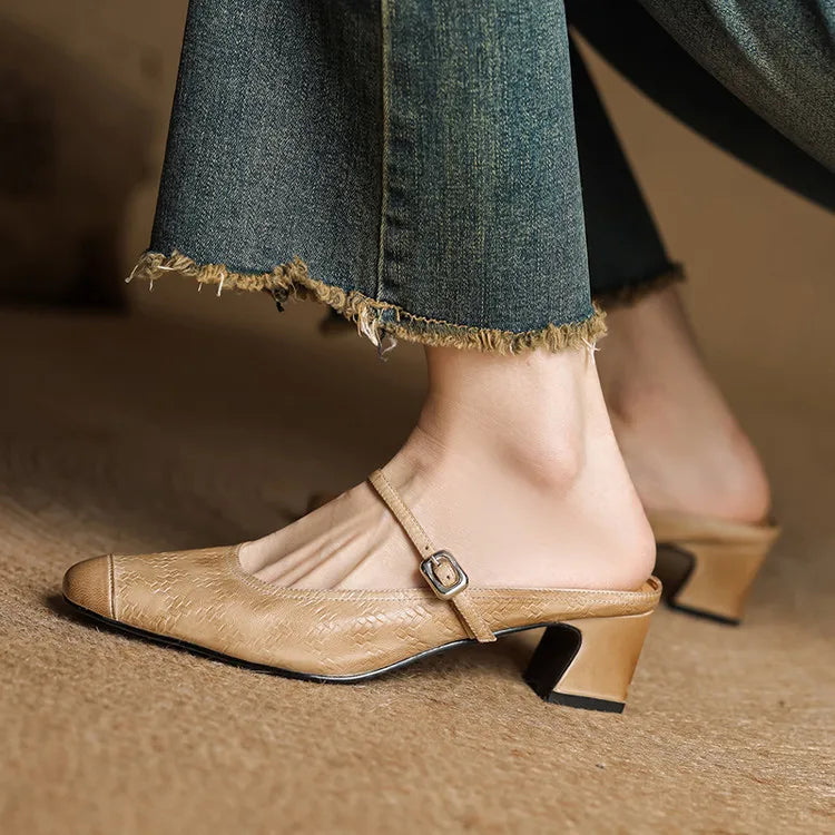 Apricot leather mules with ankle strap and block heel worn with dark denim hem