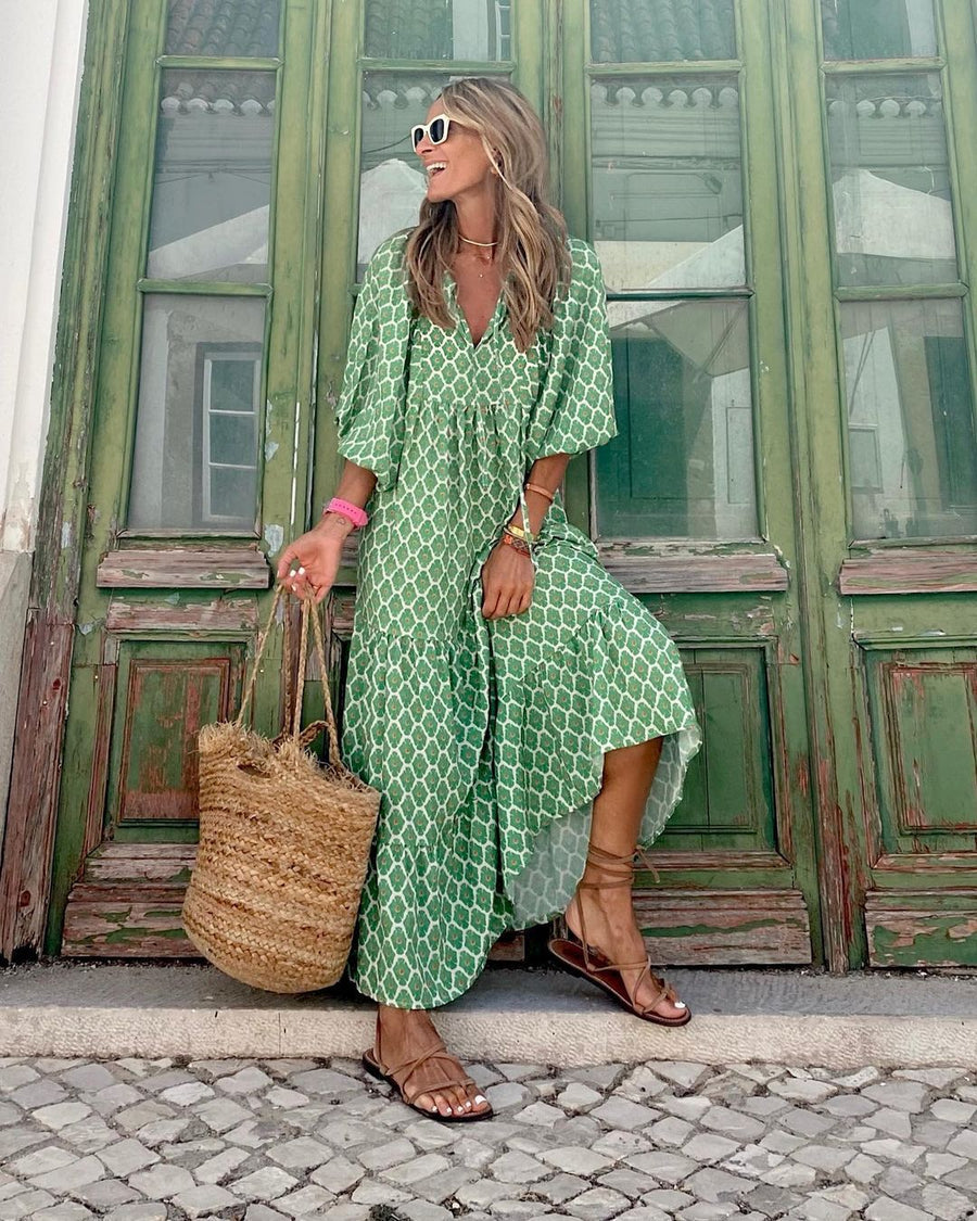Green bohemian long dress with white geometric print, V-neck, three-quarter sleeves, side slit