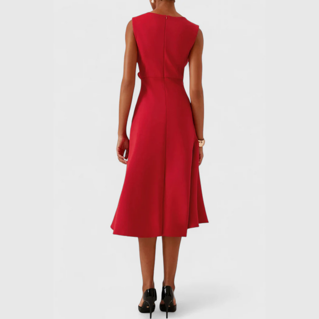 Back view of red sleeveless midi dress with seam detail and flared skirt hem