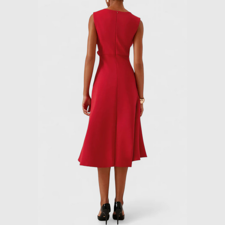 Back view of red sleeveless midi dress with seam detail and flared skirt hem