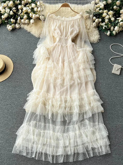White off-shoulder sheer tiered ruffle dress with smocked bodice