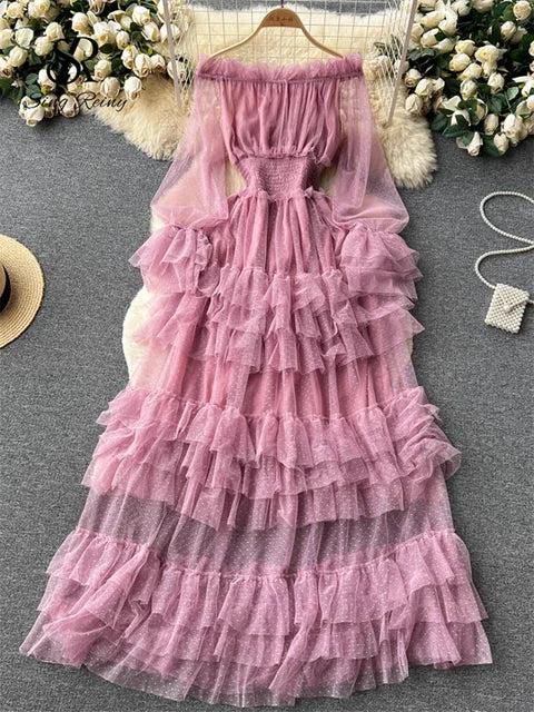 Pink sheer tiered ruffle dress with off-shoulder neckline and long sheer sleeves