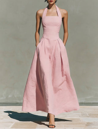Pink linen halter dress with fitted bodice and pleated midi skirt
