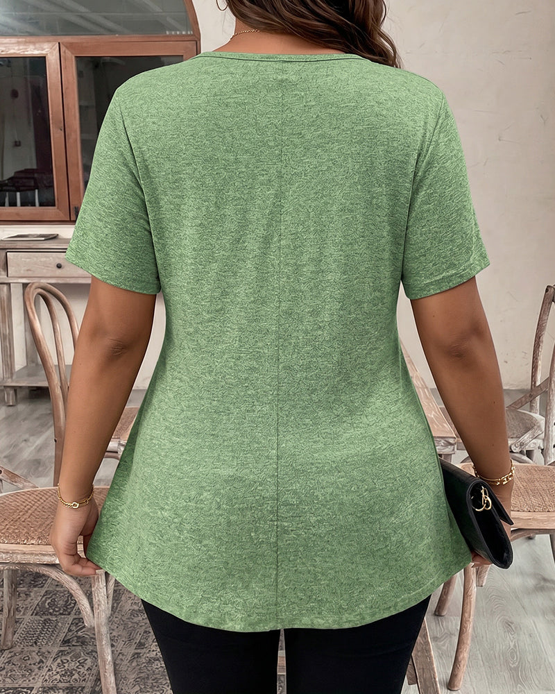 Light green short-sleeve peplum top shown from the back, scoop neckline