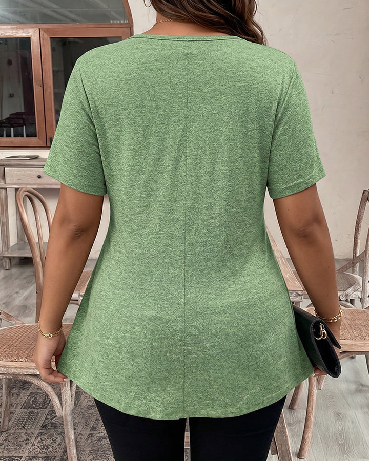 Light green short-sleeve peplum top shown from the back, scoop neckline