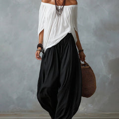 White off-shoulder top and black draped harem pants resort set with wide neckline