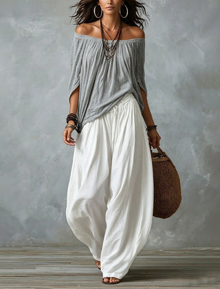 Grey off-shoulder top and white draped harem pants resort set with off-shoulder neckline