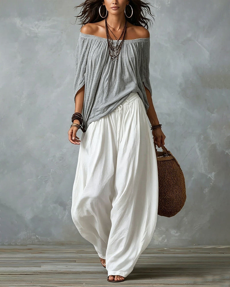 Grey off-shoulder top and white draped harem pants resort set with off-shoulder neckline