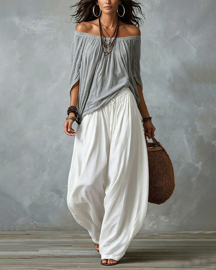 Grey off-shoulder top and white draped harem pants resort set with off-shoulder neckline