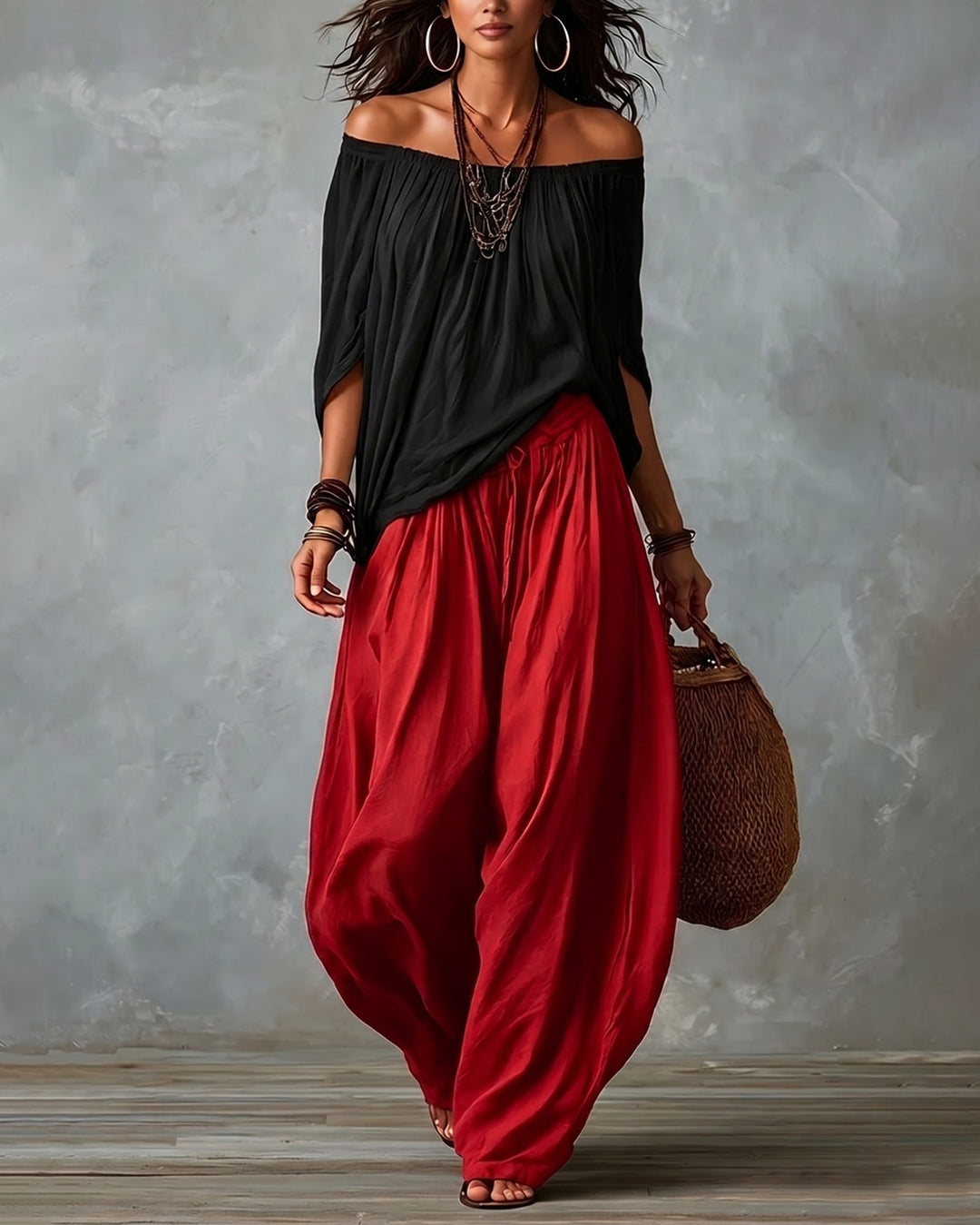 Black off-shoulder top and red draped harem pants resort set with wide neckline