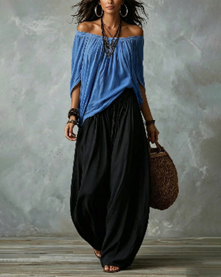 Blue off-shoulder top and black draped harem pants resort set with wide neckline