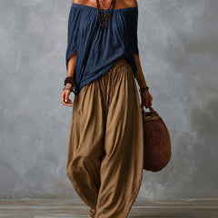 Navy off-shoulder top and olive draped harem pants resort set with wide neckline