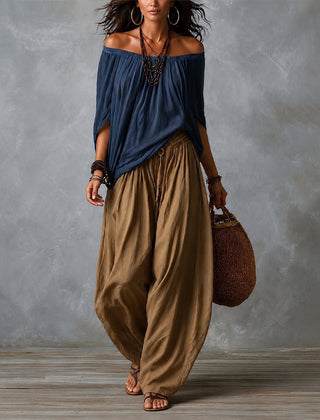 Navy off-shoulder top and olive draped harem pants resort set with wide neckline