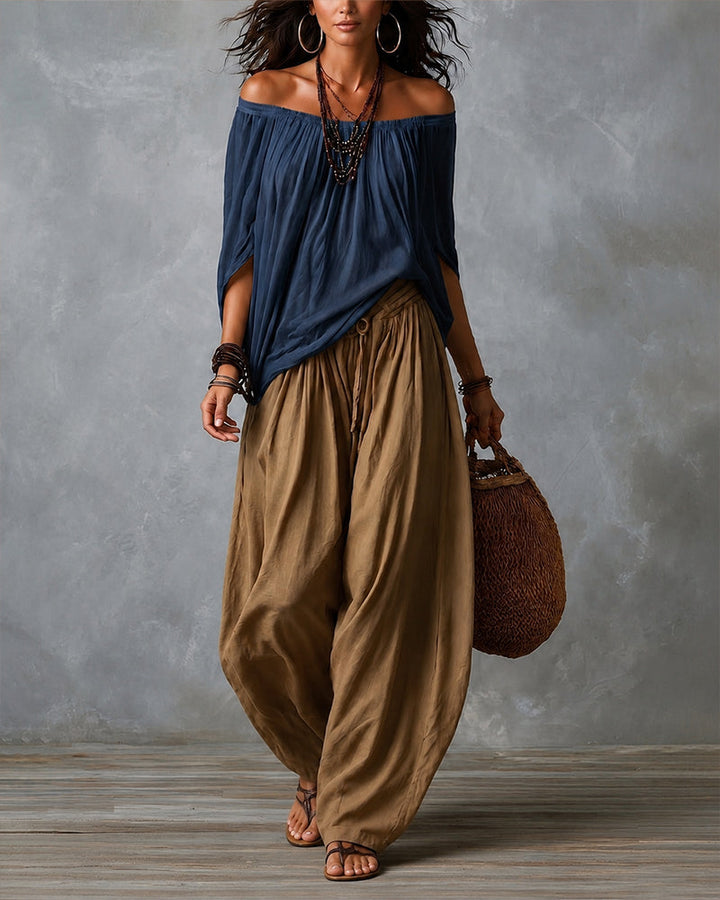 Navy off-shoulder top and olive draped harem pants resort set with wide neckline