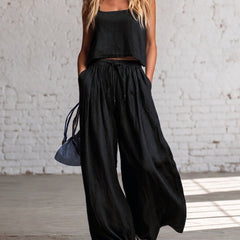 Black crop cami top with matching drawstring wide-leg pants, gathered waist