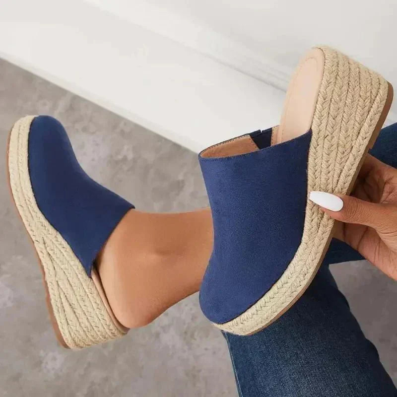 Blue wedge slide sandals with jute-textured sole and open heel