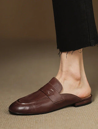 Brown leather mule with square-toe slip-on design and strap across the vamp