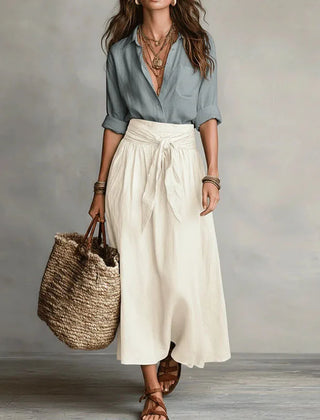 Two-tone maxi dress with gray-blue wrap-style bodice and white gathered skirt