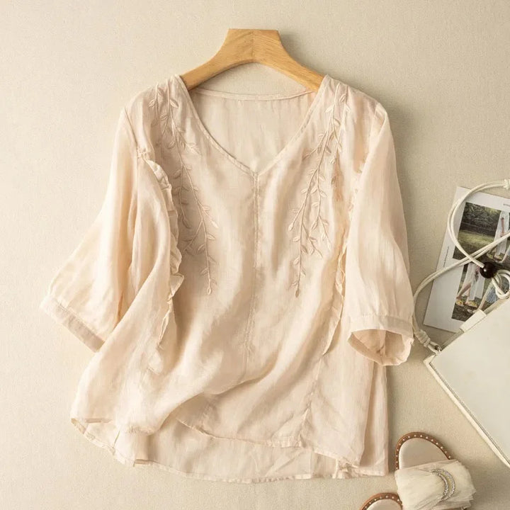 Loose retro cotton-linen top in cream with leaf embroidery at the neckline