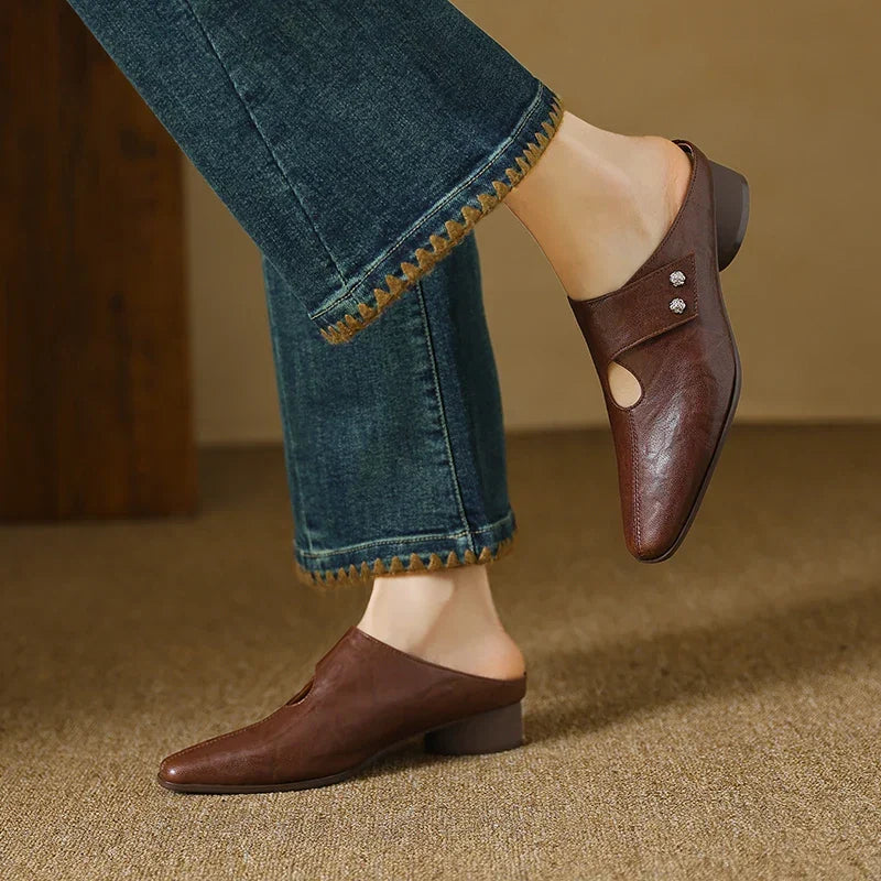 Brown leather mule with side cutout and small stud ornament, low block heel