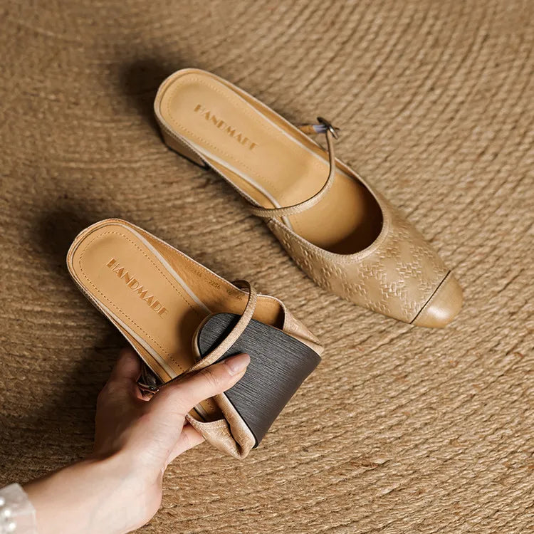 Pair of apricot leather mules with ankle strap and low block heel