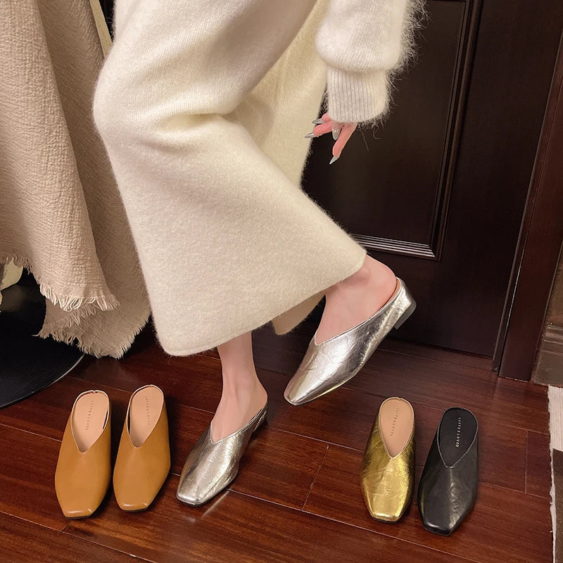 Lyra mules set with silver metallic slip-ons and low block heels