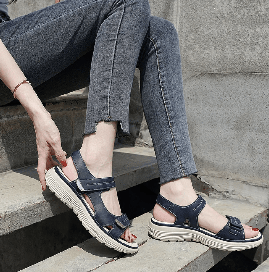 Blue orthopedic sandals with hook-and-loop straps and cushioned sole