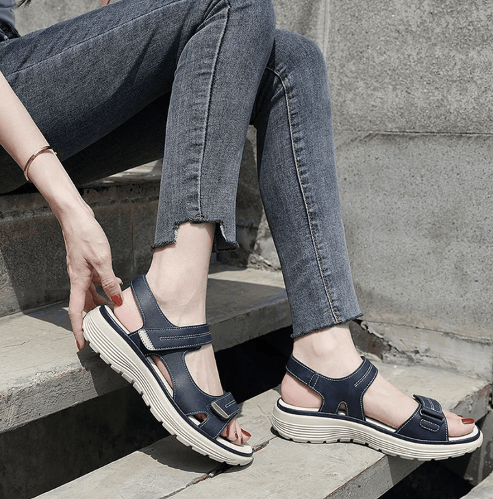 Blue orthopedic sandals with hook-and-loop straps and cushioned sole