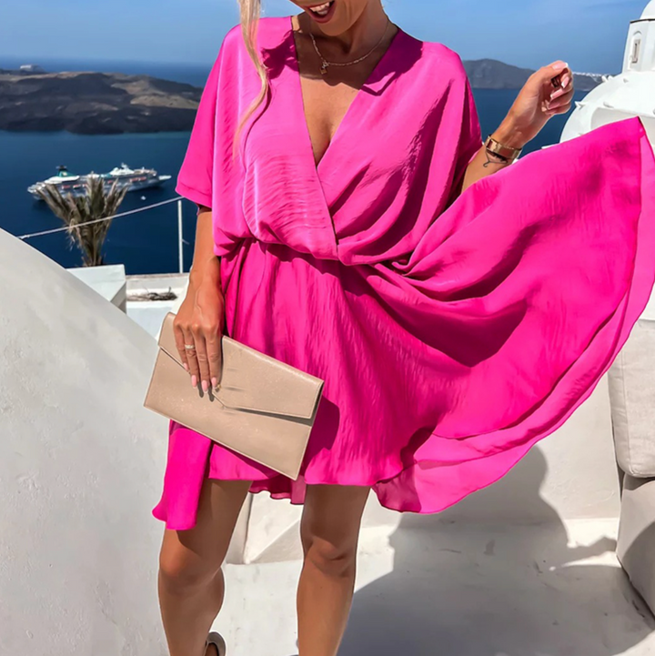 Hot pink V-neck mini dress with tie waist and flowing short kimono sleeves