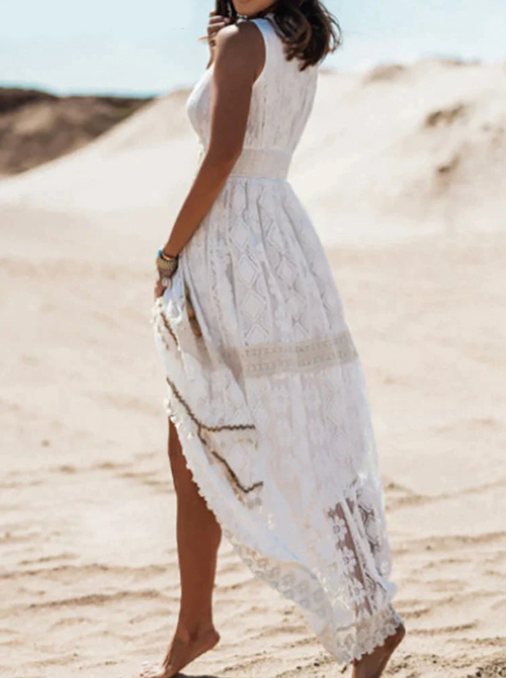 White boho maxi dress, sleeveless V-neck, openwork lace panels and draped side