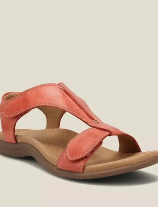 Coral-red orthopedic sandals with adjustable ankle strap and cushioned sole