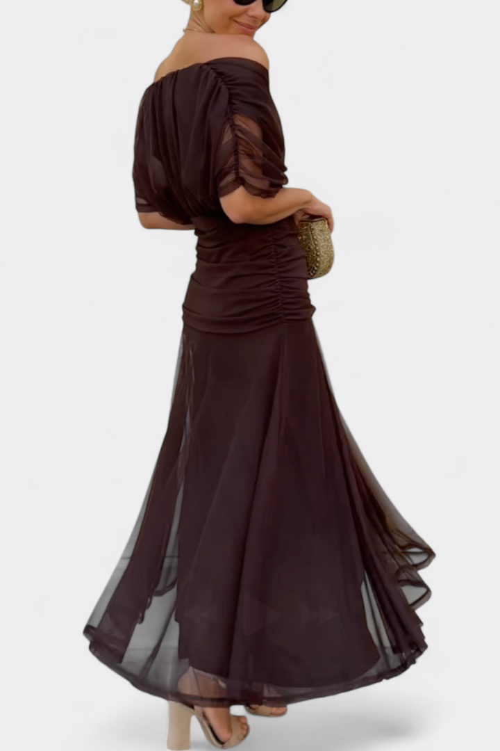 Brown off-shoulder draped midi dress, side view with flowing tiered hem and fitted waist