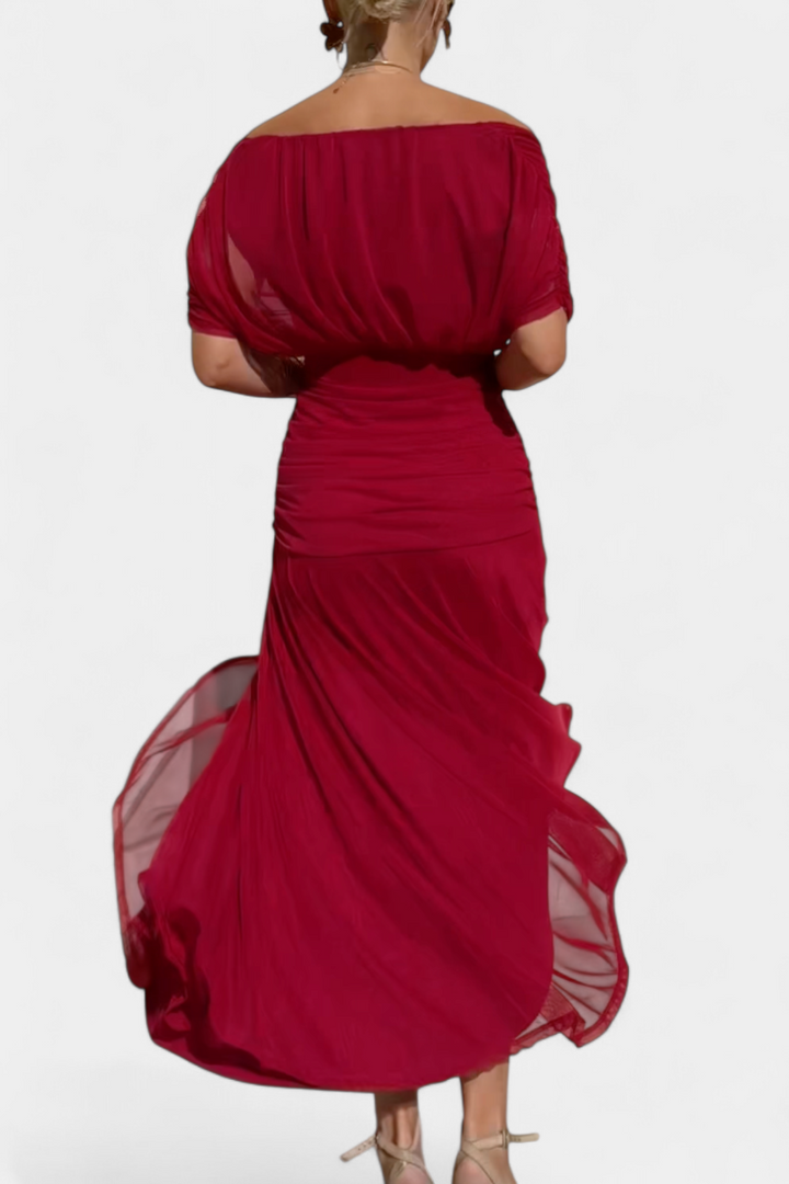 Long red off-shoulder dress with ruched waist and flowing layered skirt