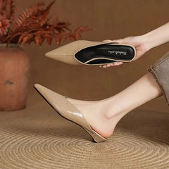 Beige leather mules with pointed toe and low heel, slip-on style