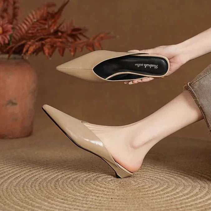 Beige leather mules with pointed toe and low heel, slip-on style