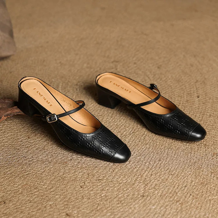 Black leather mules with pointed toe, slingback strap with buckle, low block heel