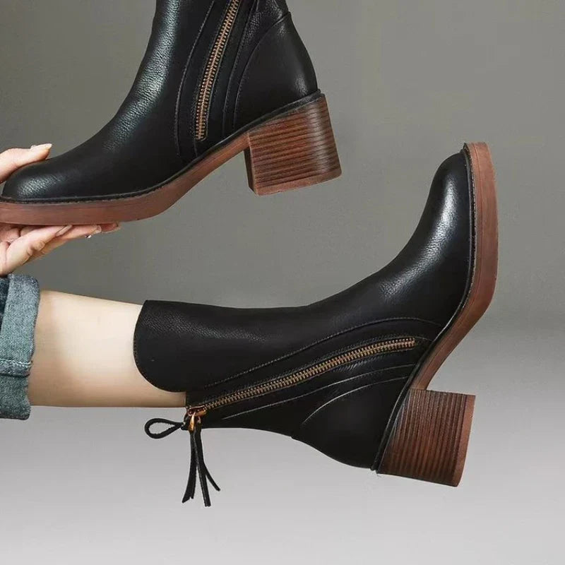 Black ankle boots with side zipper and block heel, side view
