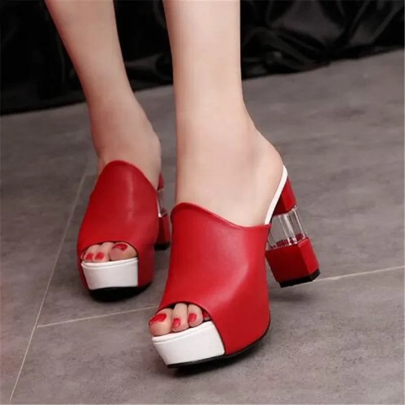 Red peep-toe heel mules with clear block heel and white sole trim