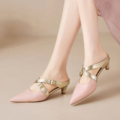 Pink textured leather mules with gold buckled ankle straps and a short block heel.