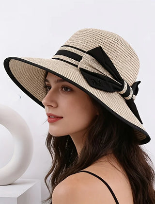Beige wide brim sun hat with black ribbon band and bow detail