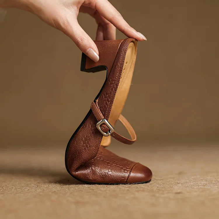 Brown leather mule with ankle strap and block heel, square toe