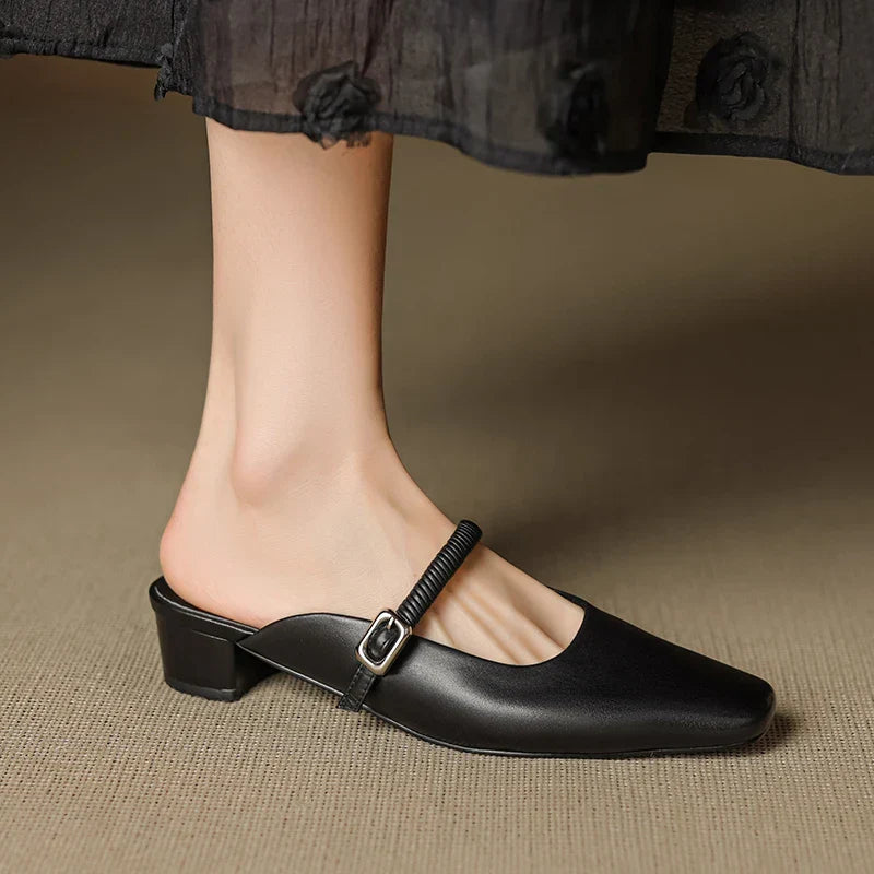 Black genuine leather Mary Jane mule with pointed toe and buckled strap, block heel