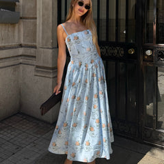 Light blue floral midi dress with spaghetti straps and tiered skirt